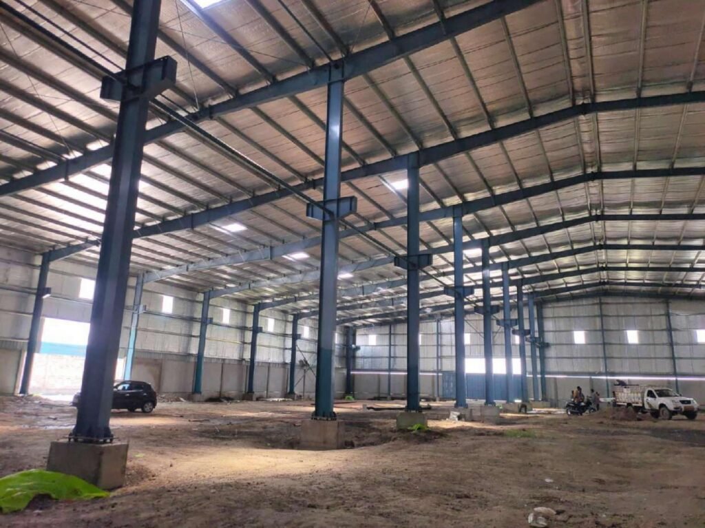 PEB steel frame with columns and rafters during erection