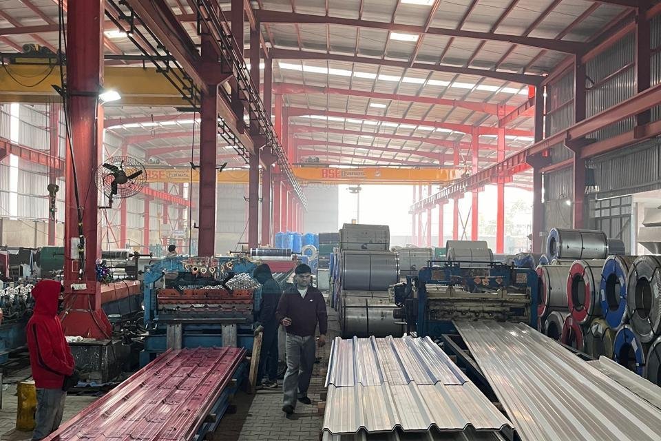 Colour-coated roofing sheets at the Mahawar Prefab Solutions plant