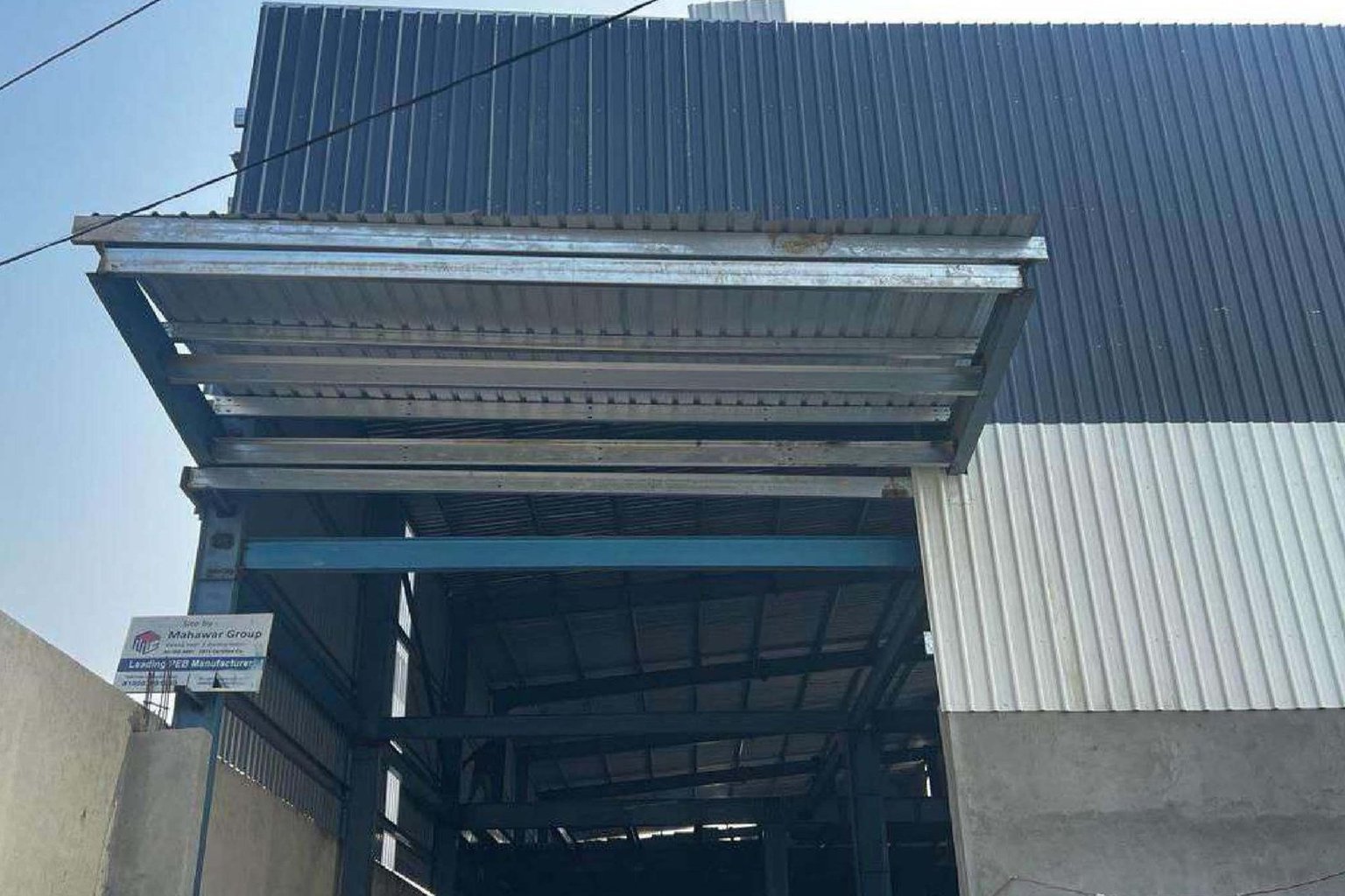 Farm building with steel structure and colour-coated sheets by Mahawar Prefab Solutions