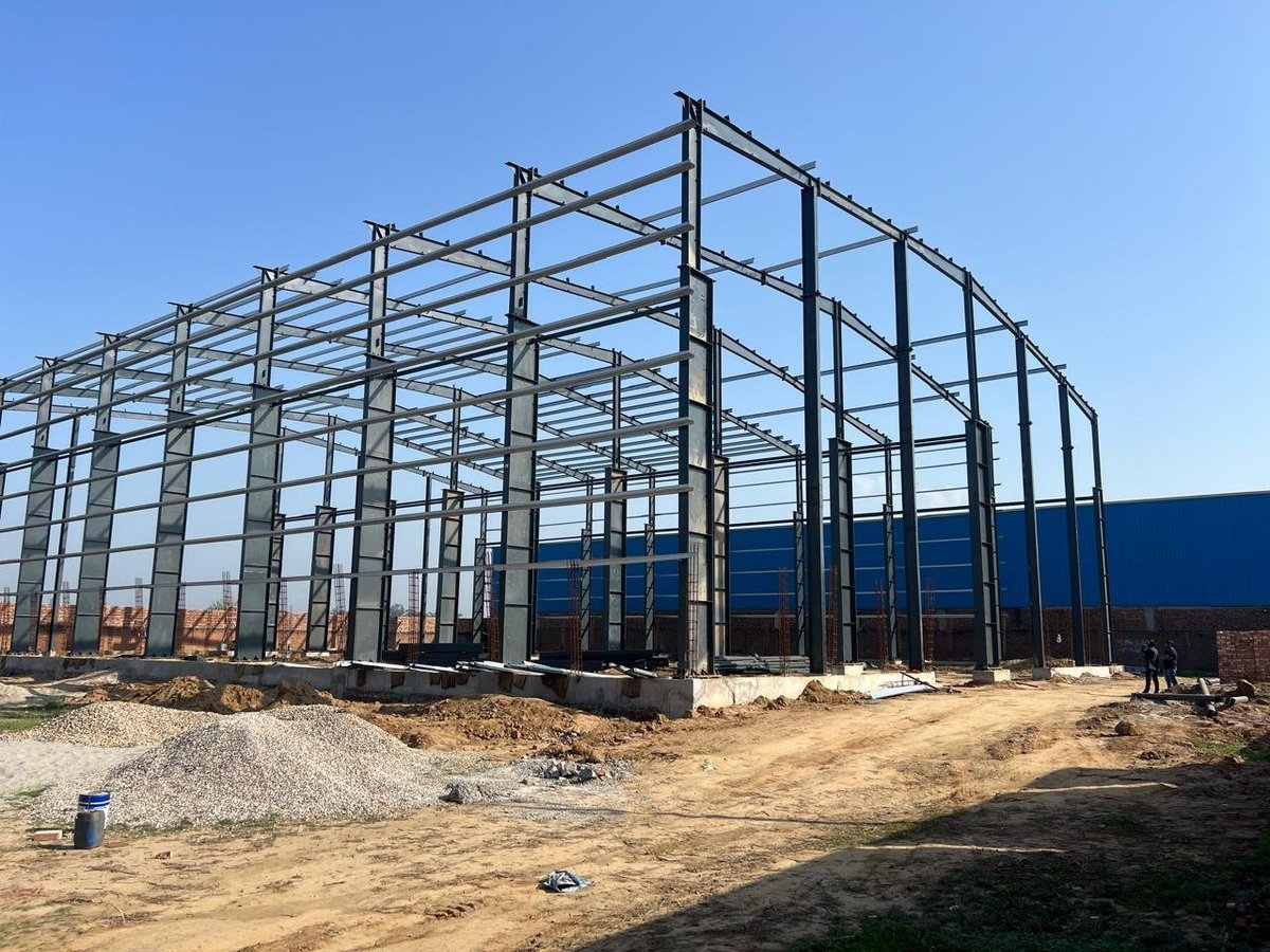 PEB steel frame during erection by Mahawar Prefab Solutions